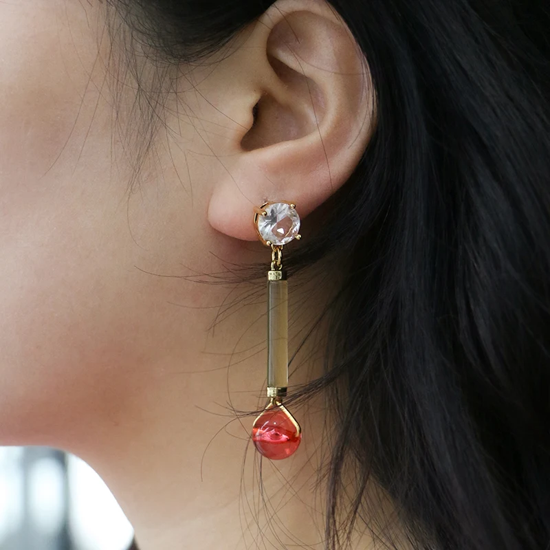 Long transparency acrylic pendant with diamond earrings